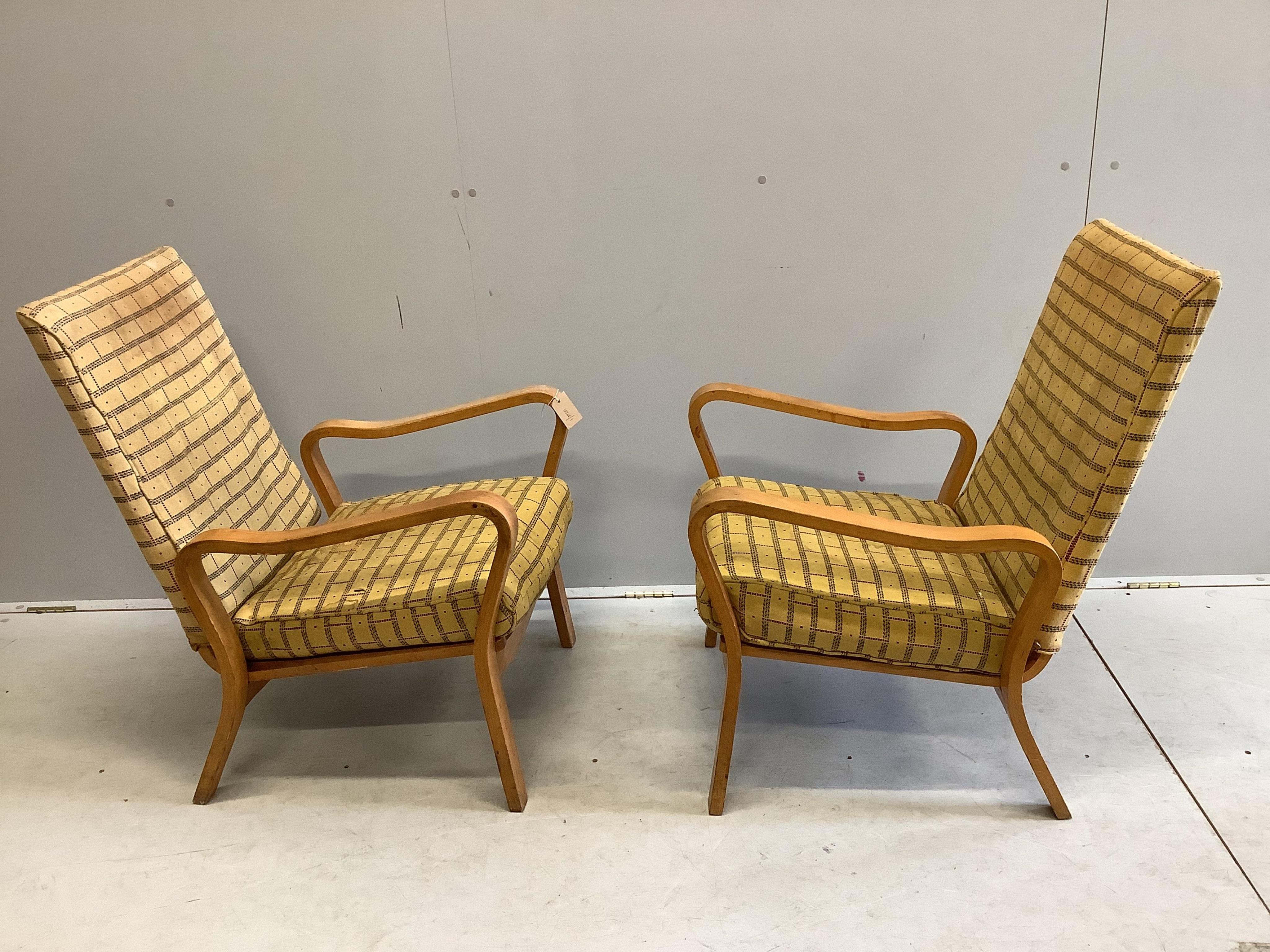 A pair of mid century Eric Lyons Tecta armchairs, width 56cm, depth 54cm, height 85cm. Condition - fair, upholstery poor